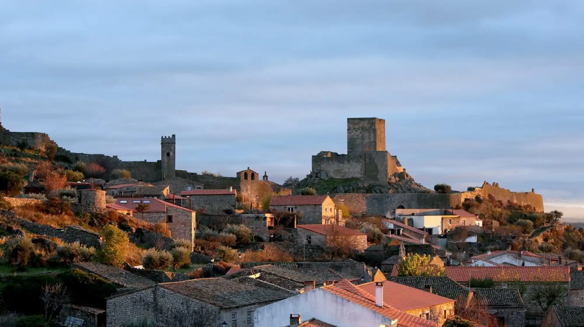 Walled village of Marialva featuring castle ruins and granite paths